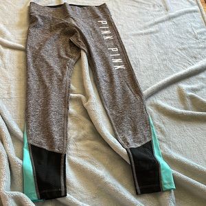 Never worn Gray leggings with teal on the bottom from pink